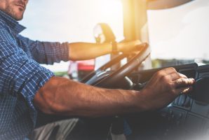 Semi Truck Driver Job. Caucasian Trucker Preparing For Long Haul Shipping.